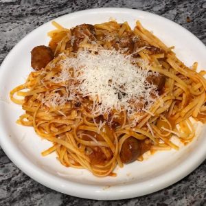 Plated pasta with chicken sausage with tomato Pinerolo sauce | AnnaMaria's