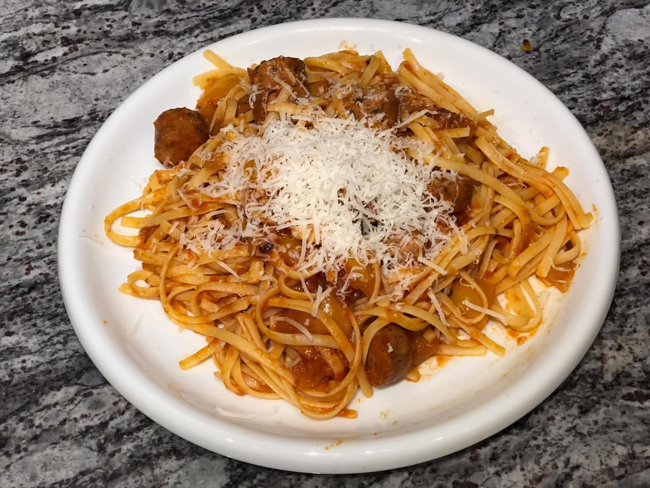 Plated pasta with chicken sausage with tomato Pinerolo sauce | AnnaMaria's
