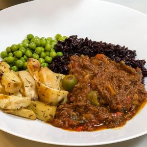 Traditional ropa vieja in a white serving dish | AnnaMaria's