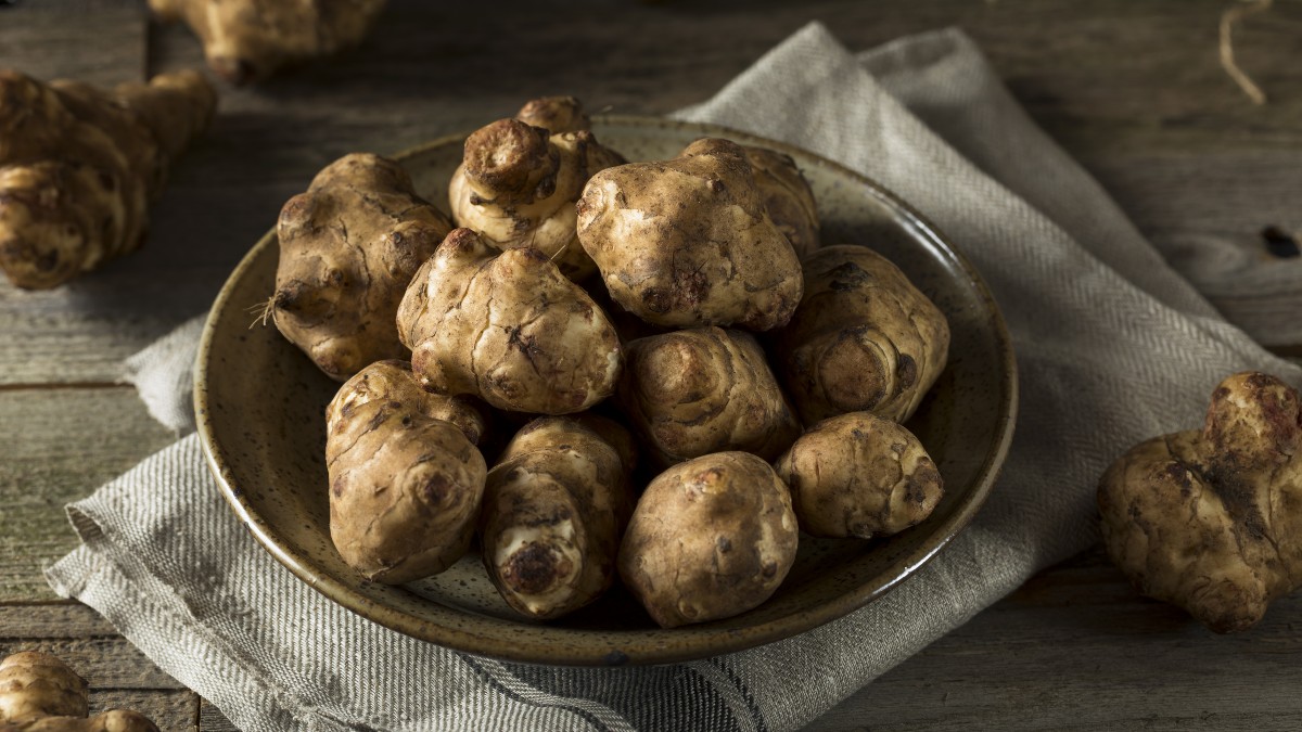 Sunchokes known as Jerusalem Artichokes or Topinambur in Italy on a plate | AnnaMaria's