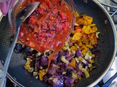 Adding veggies and bagna to caponata recipe | AnnaMaria's
